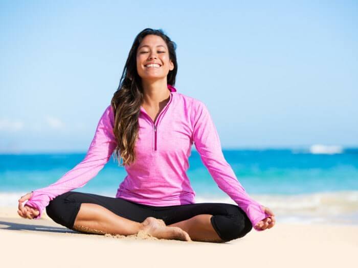 Yoga on Beach Wellness Origin